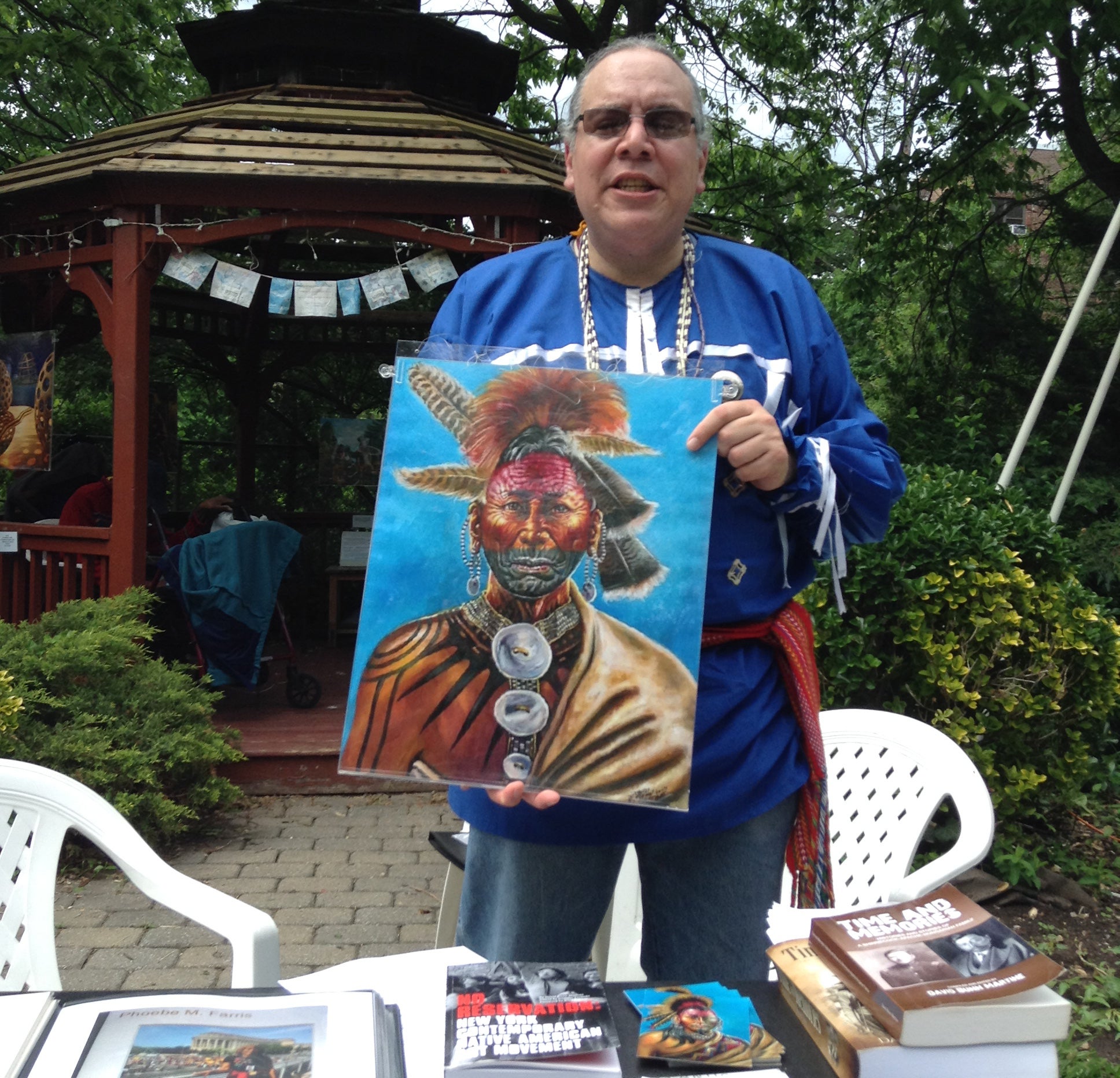 avid Martine (Shinnecock) holding his painting  ,"Wyandanch, Montauk Sachem