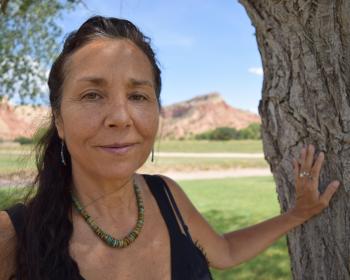 Dr. Ruby Gibson standing in front of a tree, smiling