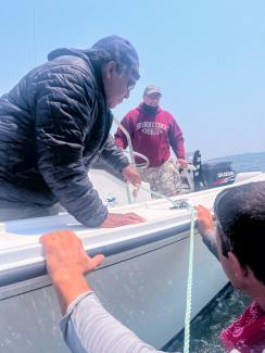 Roddy Smith, Dudley Nation two Shinnecock Support boat members. Photo by Chenae Bullock