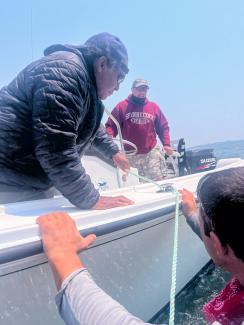 Roddy Smith, Dudley Nation two Shinnecock Support boat members. Photo by Chenae Bullock