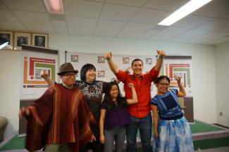 Members of the Global Indigenous Youth Caucus in a celebratory moment.