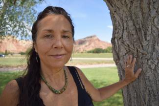 Dr. Ruby Gibson standing in front of a tree, smiling